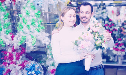 Man buys a bouquet of flowers