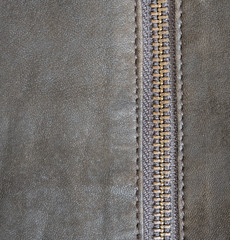 Brown leather texture and zipper background.