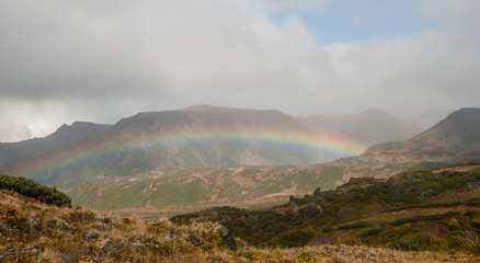 Obraz na płótnie Canvas Rainbow over the valley in Kamchatka