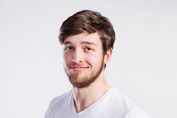 Fototapeta premium Handsome hipster fitness man in white t-shirt, studio shot.