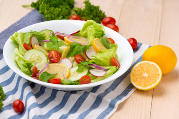 Homemade fresh green vegetable salad on table.