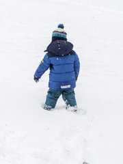 Fototapeta na wymiar Running, Playing Child at Snow