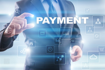 Businessman selecting payment on virtual screen.