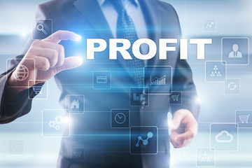 Businessman selecting profit on virtual screen.