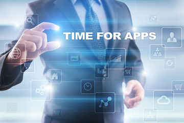 Businessman selecting time for apps on virtual screen.