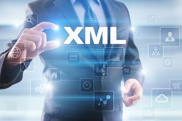 Businessman selecting xml on virtual screen.