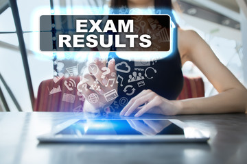 Woman using tablet pc and selecting exam results.