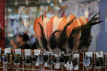 Feather headdress / Feather headdress on shelf in the store. Shallow depth of field.