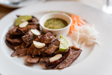 Sliced grilled Beef steak Ribeye with Garlic, chili, lemon