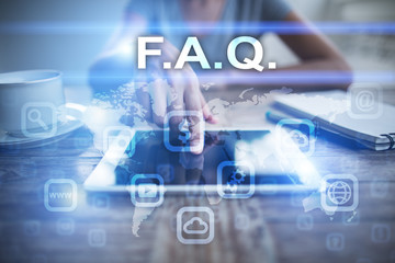 Woman using tablet pc, pressing on virtual screen and selecting f.a.q..