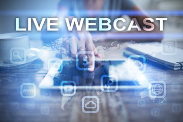 Fototapeta premium Woman using tablet pc, pressing on virtual screen and selecting live webcast.