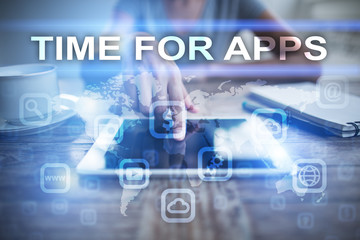 Fototapeta premium Woman using tablet pc, pressing on virtual screen and selecting time for apps.
