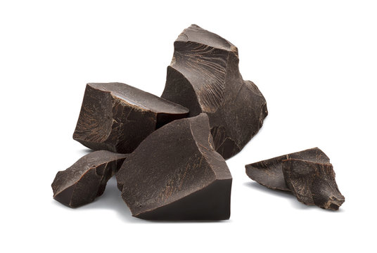 Broken chocolate pieces isolated on white background