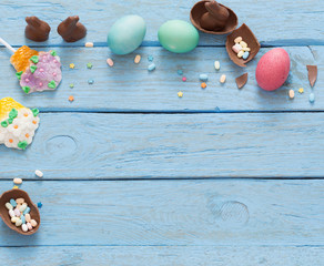 Easter Eggs Over Blue Wooden Background