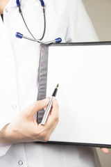 doctor's hands with a plane-table shows pen. Healthcare and medical concept 