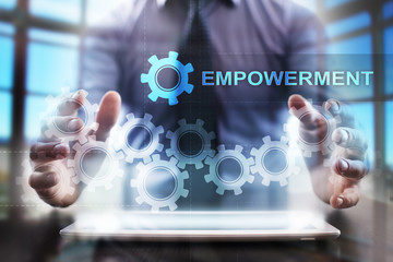 Businessman using tablet pc and selecting empowerment.