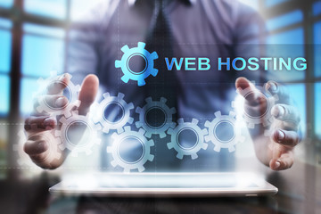 Businessman using tablet pc and selecting web hosting.