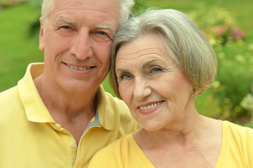 Happy elderly couple embracing