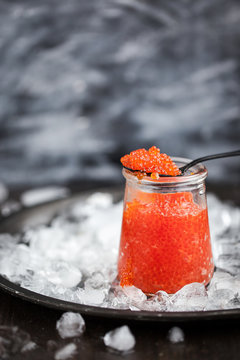 Red caviar in a glass jar