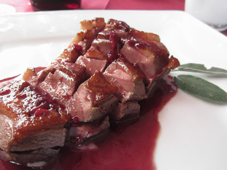 Duck breast on Sangiovese red wine sauce . Italian recipe