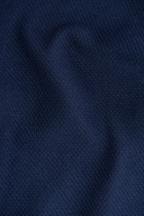 Dark blue wrinkled fabric.