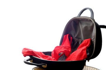 Beauty case containing a red swimsuit thrown in a disorderly