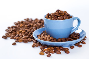 A coffee mug of coffee beans