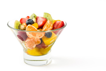 Fruit salad in crystal bowl isolated on white background

