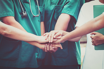 Doctors and nurses coordinate hands. Concept Teamwork - obrazy, fototapety, plakaty