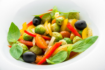 Salad of fried Brussels sprouts, paprika and olives