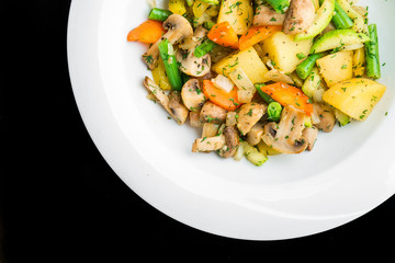 Hot salad with fried potatoes, mushrooms and asparagus