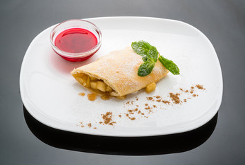 Strudel with apples and berry sauce