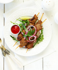 Beef shish kebab  on skewers in curry.