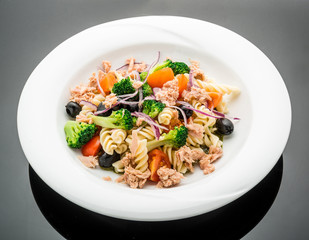 Pasta salad with tuna, olives and cherry tomatoes