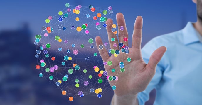 Man with open hand touching connectors against Night city