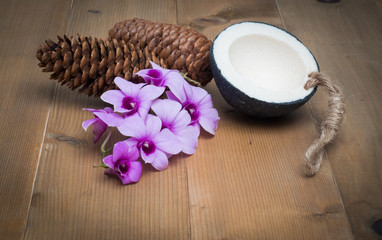 Aromatherapy  product  Spa set ,candle ,soap,coconut orchid flower,shell,  massage  with white wood  background . top view composition.