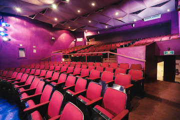 Theater stage and seats with dramatic lighting