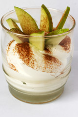 Fresh apple dessert with cinnamon and cream..