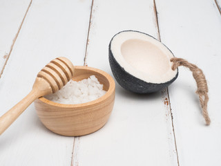 Aromatherapy  product  Spa set ,candle ,soap,coconut orchid flower,shell,  massage  with white wood  background . top view composition.