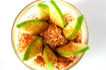 Fresh apple dessert with cinnamon and cream..