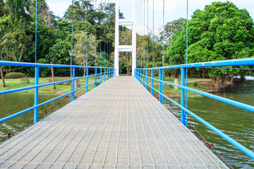 Suspension bridge for walking over river in public park