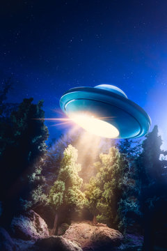 High contrast image of UFO flying over a forest with light beam at night