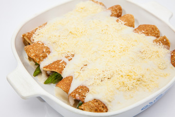 Quinoa crepes preparation :  Quinoa crepes with white sauce and parmesan cheese
