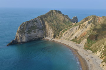 Fototapeta na wymiar Beach and cliff areas near Durdle door in Dorset. 