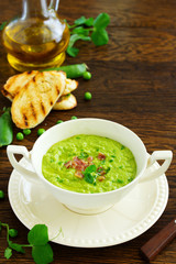 Soup of green peas with bacon and mint.