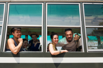 Happy team in a bus at Harmony World Puppet Festival 2017 in Kanchanaburi, Thailand