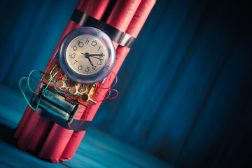 High contrast image of a timebomb on a wooden background