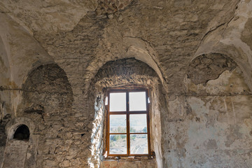 Fototapeta na wymiar Abandoned medieval castle Saint Miklosh interior, Chinadievo, Western Ukraine.