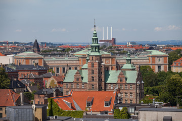 Cityscape of Copenhagen from the Round Tower. City center roofs and Rosenborg castle