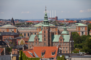 Fototapeta na wymiar Cityscape of Copenhagen from the Round Tower. City center roofs and Rosenborg castle